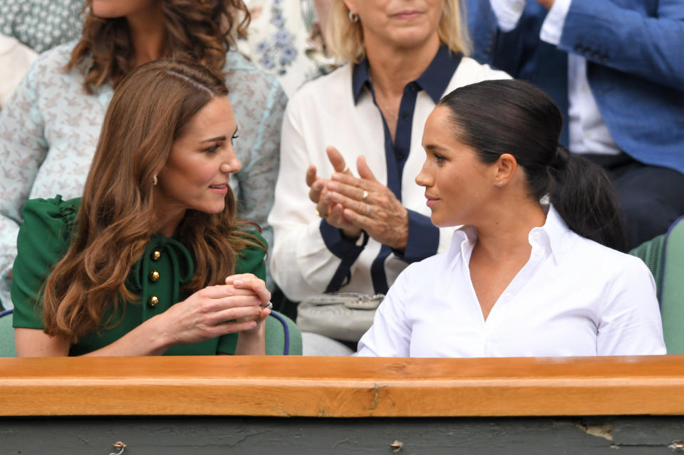 LONDON, ENGLAND - JULY 13: Catherine, Duchess of Cambridge and Meghan, Duchess of Sussex in the Royal Box on Centre Court during day twelve of the Wimbledon Tennis Championships at All England Lawn Tennis and Croquet Club on July 13, 2019 in London, England. (Photo by Karwai Tang/Getty Images)