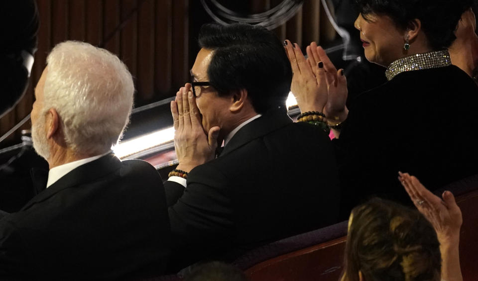 Ke Huy Quan reacts in the audience as he is announced the winner for best performance by an actor in a supporting role for "Everything Everywhere All at Once" at the Oscars on Sunday, March 12, 2023, at the Dolby Theatre in Los Angeles. (AP Photo/Chris Pizzello)