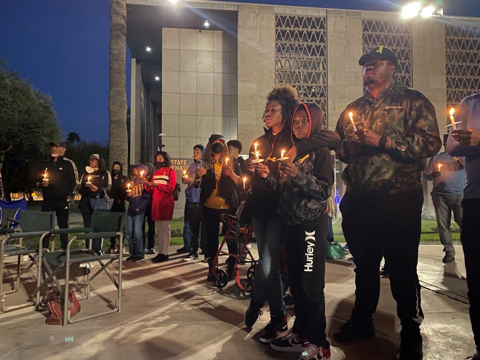 Dozens gathered for a candlelight vigil to honor missing geologist Daniel Robinson on Saturday, March 12, 2022, at the Arizona Capitol in Phoenix.