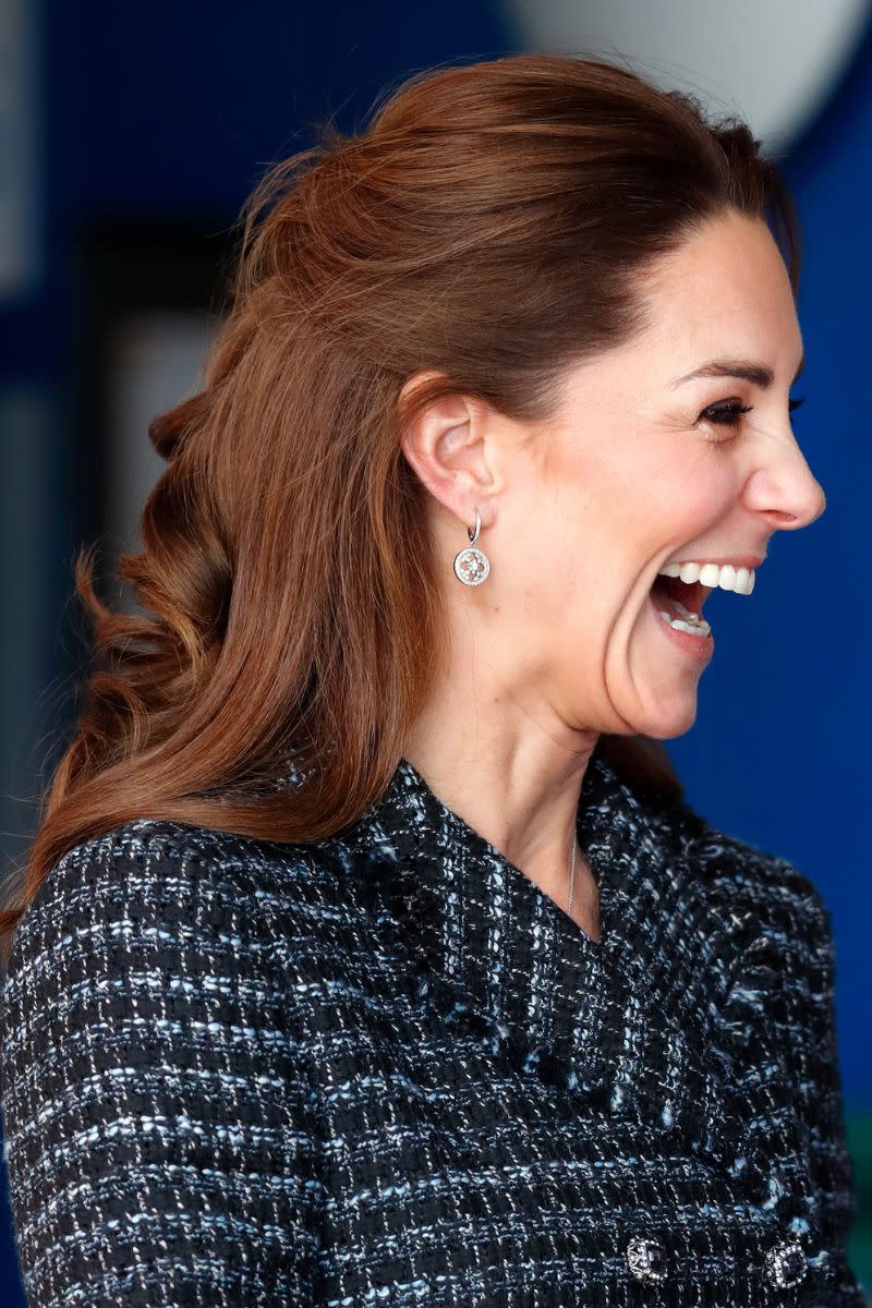 Kate Middleton headshot with a half up curly hairstyle