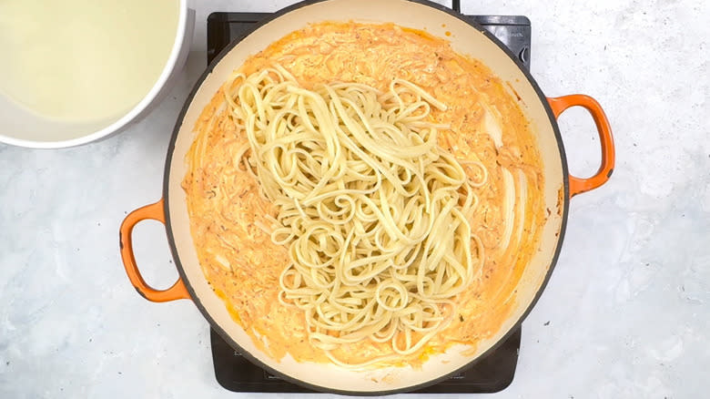 pasta and kimchi sauce in pan