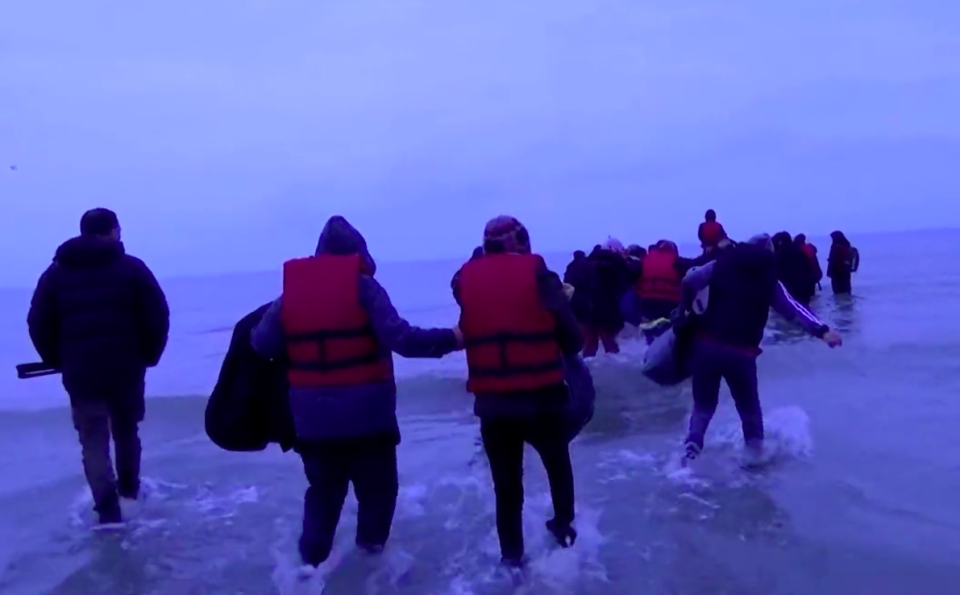 Migrants were filmed entering the dinghy in France on their way to the UK. (Reuters)