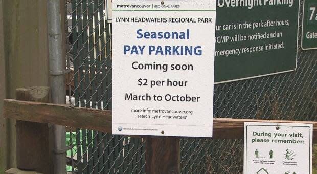 A sign at Lynn Headwaters Regional Park in North Vancouver advises park users that parking will soon cost $2 per hour.