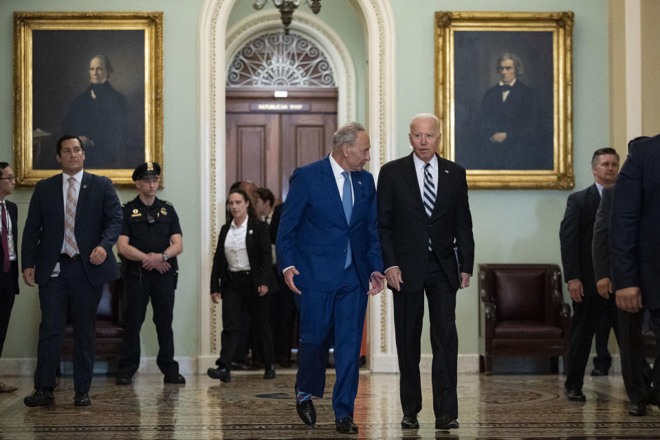U.S. President Joe Biden, right, arrives to the U.S. Capitol with Senate Majority Leader Chuck Schumer, a Democrat from New York, in Washington, D.C., U.S., on Wednesday, July 14, 2021. (Al Drago/Bloomberg via Getty Images)