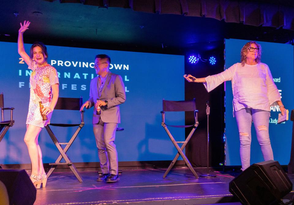 Judy Gold introduces Jenny Slate and Bowen Yang on stage on Thursday for the 24th Provincetown International Film Festival. Slate and Yang were co-recipients of the festival's New Wave Award.