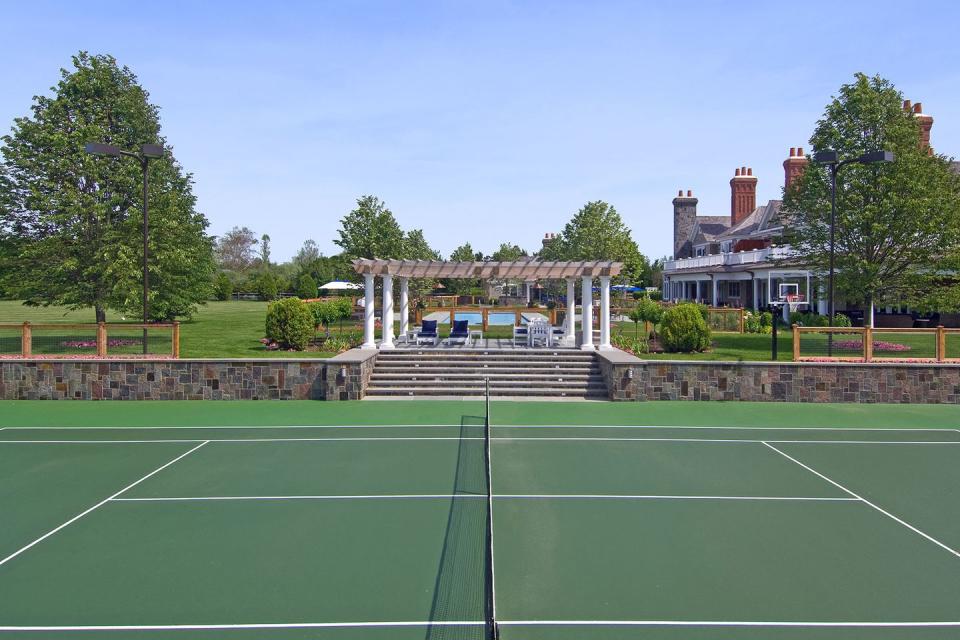 And a tennis court with a pergola.