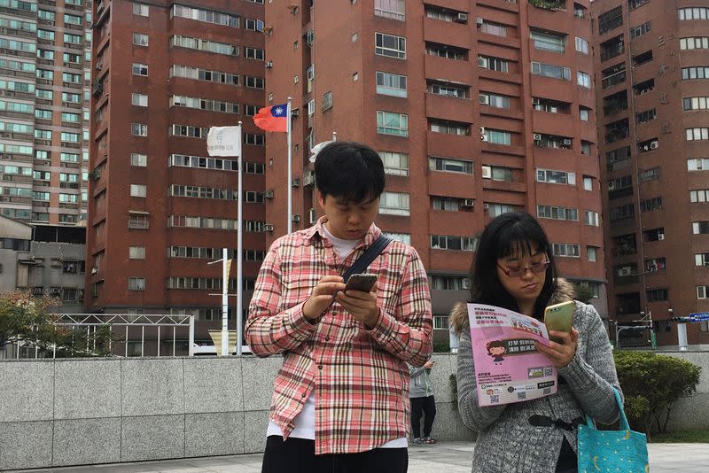 People attend an event organised by Taiwanese NGO Fake News Cleaner on how to spot and report suspected fake news, in New Taipei City