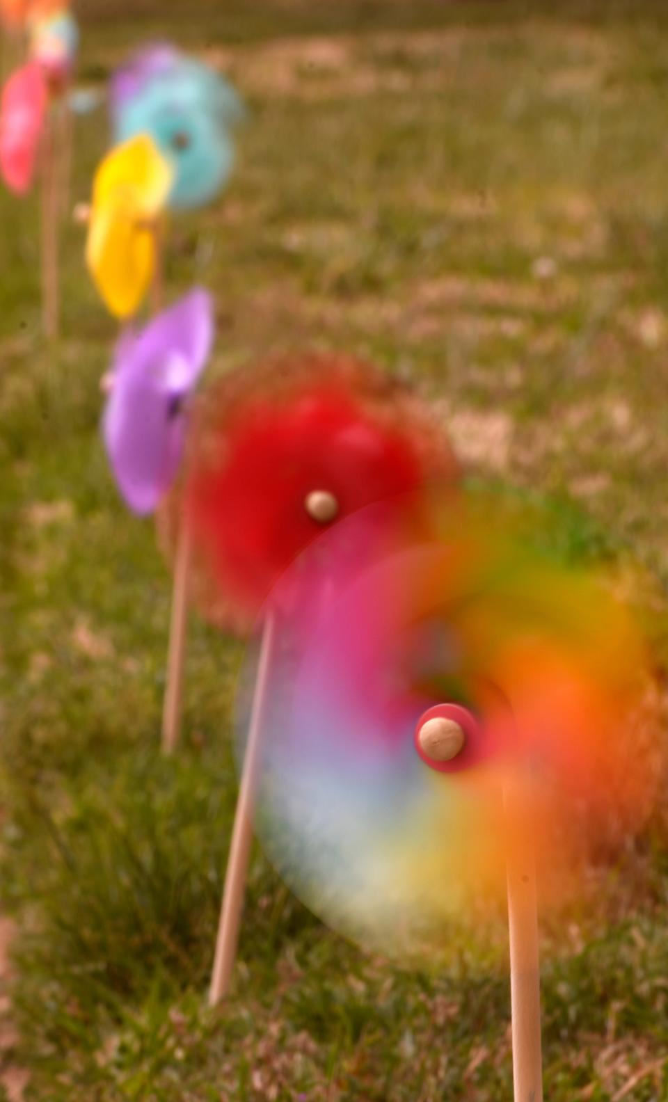 Pinwheels spin during a high wind warning, Tuesday, April 4, 2023. The pinwheels put on display around the Hub City have taken quite a spin so far this month.