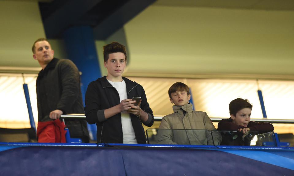 Football - Chelsea v Paris St Germain - UEFA Champions League Second Round Second Leg - Stamford Bridge, London, England - 11/3/15 David Beckham's sons Brooklyn, Romeo and Cruz watch from the stands before the match Action Images via Reuters / Tony O'Brien Livepic EDITORIAL USE ONLY.