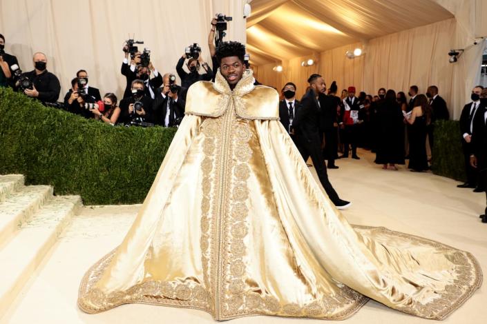 <div class="inline-image__caption"><p>Lil Nas X surveys his red carpet kingdom at the Met Gala in a Versace robe.</p></div> <div class="inline-image__credit">DIMITRIOS.KAMBOURIS@GETTYIMAGES.COM</div>