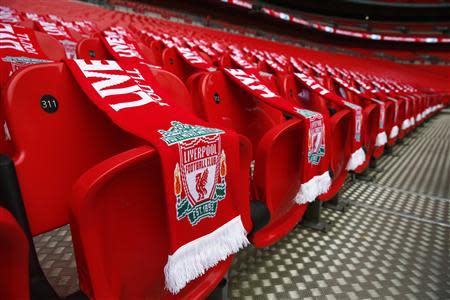 Ninety-six Liverpool scarves are placed on seats on the 25th anniversary of the Hillsborough disaster before the FA Cup semi-final soccer match between Arsenal and Wigan Athletic at Wembley Stadium in London April 12, 2014. REUTERS/Eddie Keogh