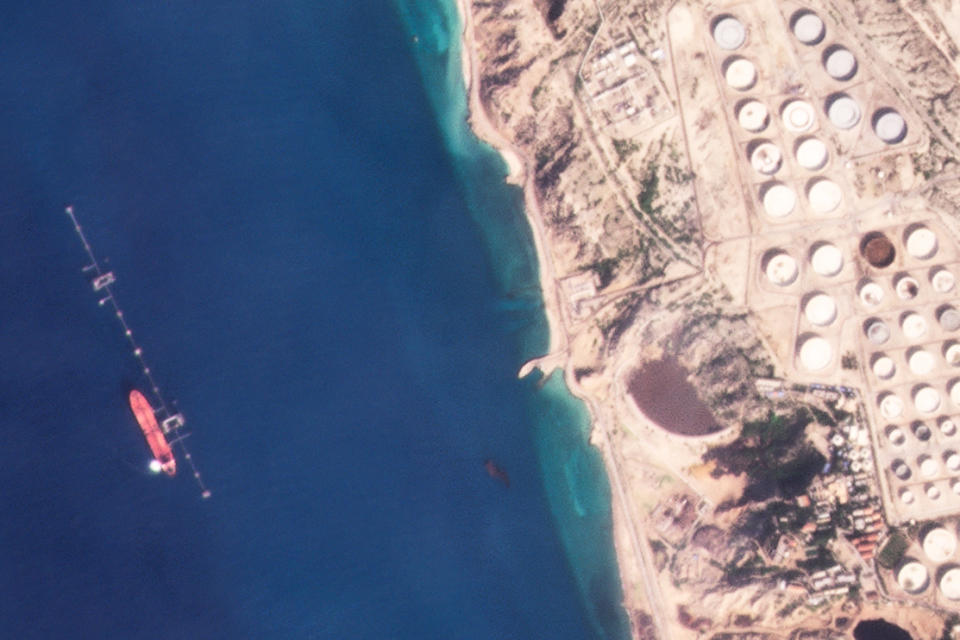 In this satellite photo provided by Planet Labs PBC, a vessel identified as the Virgo by the advocacy group United Against Nuclear Iran is seen off Khargh Island, Iran, on Jan. 16, 2022. The Suez Rajan, a tanker owned by Fleetscape, a subsidiary of Los Angeles-based Oaktree Capital Management, likely took part in the illicit trade of Iranian crude oil at sea despite American sanctions targeting the Islamic Republic amid the collapse of its nuclear deal with world powers, the advocacy group alleges. The firm said Thursday, Feb. 17, 2022, that it is cooperating with U.S. government investigators. (Planet Labs PBC via AP)