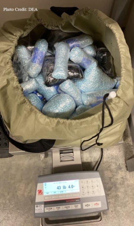 A man has been charged after officials found illegal drugs and a large amount of cash. When they executed the warrant, officials reportedly found 2800 blue "M-30" fentanyl pills, about $33,000 and "a larger amount" of fentanyl pills that weighed 43 pounds and four ounces. (Drug Enforcement Agency)