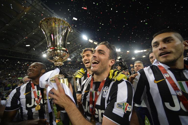 Juventus' Alessandro Matri celebrates with the trophy after they beat Lazio 2-1 in the Italian Cup final on May 20, 2015 at the Stadio Olimpico in Rome