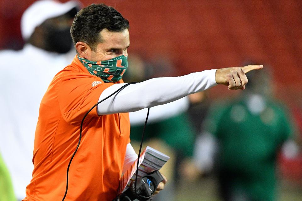 Sep 19, 2020; Louisville, Kentucky, USA;  Miami Hurricanes head coach Manny Diaz reacts after a touchdown during the second half against at Louisville. [Jamie Rhodes-ACC Pool]