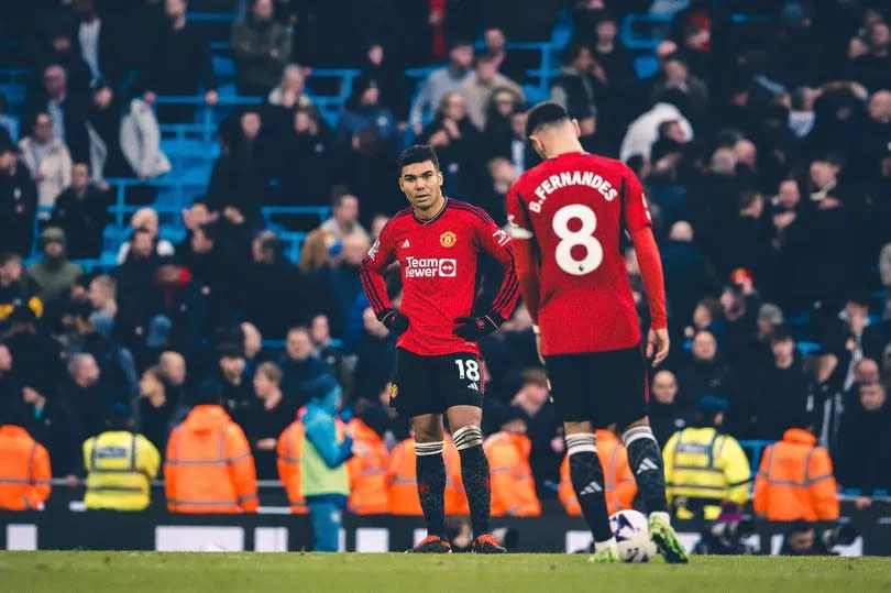 Manchester United midfielders Casemiro and Bruno Fernandes react during the defeat to Manchester City