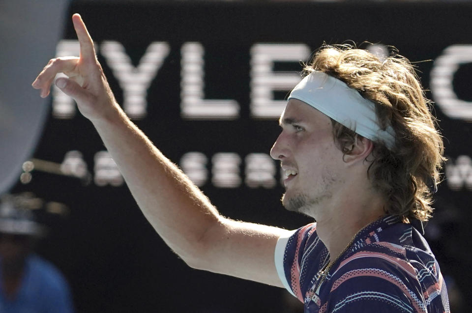 Germany's Alexander Zverev celebrates after defeating Switzerland's Stan Wawrinka in their quarterfinal match at the Australian Open tennis championship in Melbourne, Australia, Wednesday, Jan. 29, 2020. (AP Photo/Lee Jin-man)