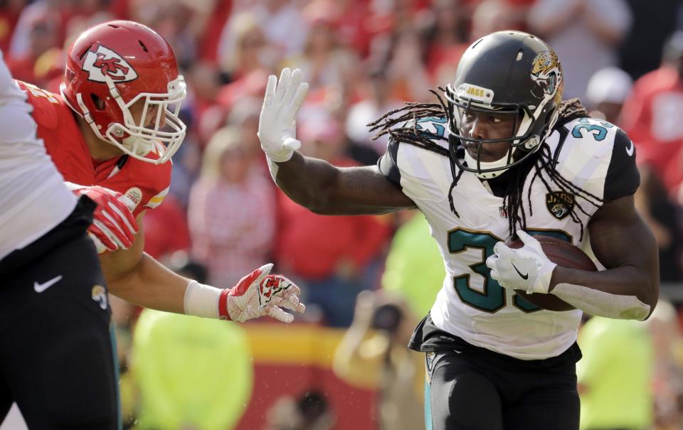 <p>Jacksonville Jaguars running back Chris Ivory (33) runs away from Kansas City Chiefs linebacker Frank Zombo (51) during the first half of an NFL football game in Kansas City, Mo., Sunday, Nov. 6, 2016. (AP Photo/Charlie Riedel) </p>