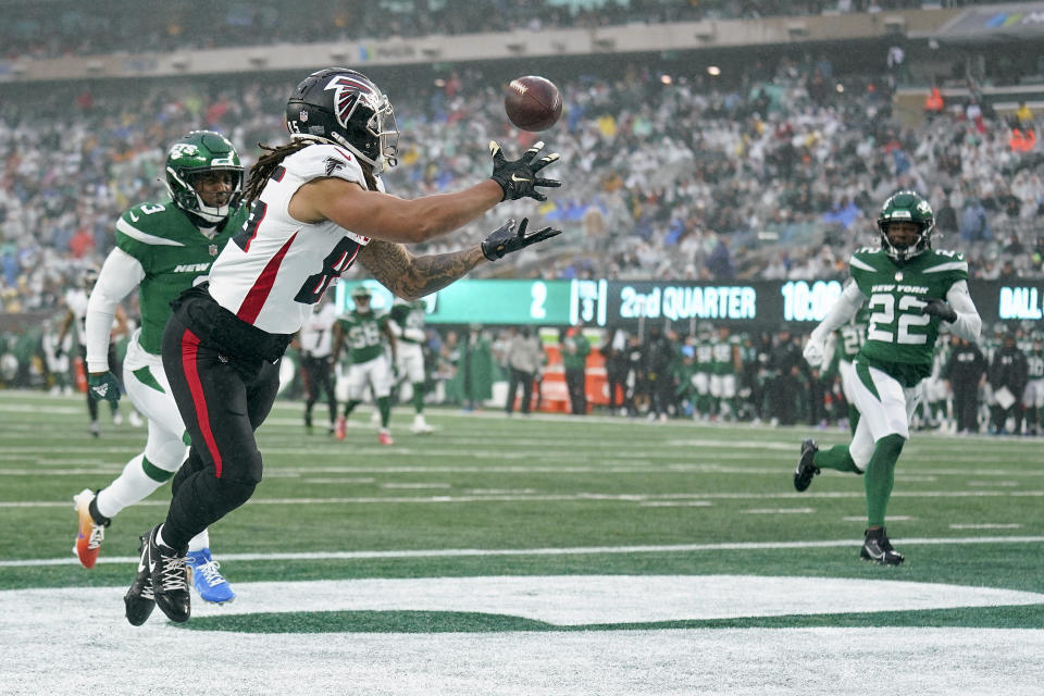 Atlanta Falcons tight end MyCole Pruitt (85) catches a pass for a touchdown against New York Jets safety Jordan Whitehead (3) and safety Tony Adams (22) during the second quarter of an NFL football game, Sunday, Dec. 3, 2023, in East Rutherford, N.J. (AP Photo/Seth Wenig)