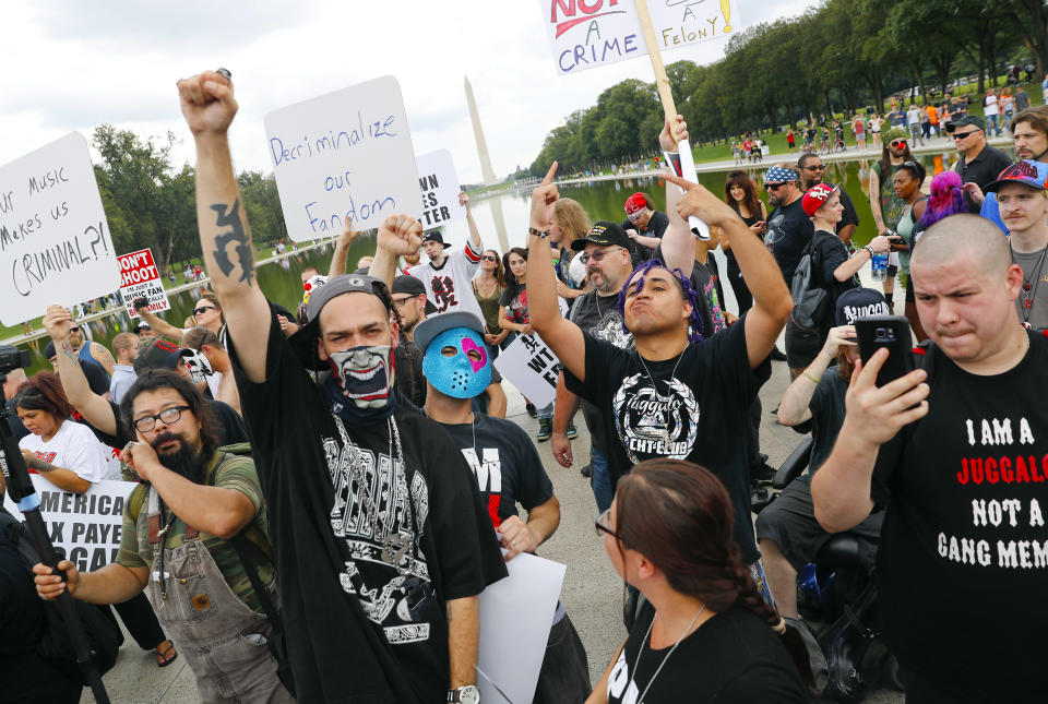 <p>Juggalos, as supporters of the rap group Insane Clown Posse are known, gather in front of the Lincoln Memorial in Washington during a rally, Saturday, Sept. 16, 2017, to protest and demand that the FBI rescind its classification of the juggalos as “loosely organized hybrid gang.” (Photo: Pablo Martinez Monsivais/AP) </p>