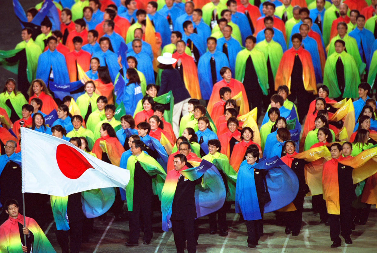 15 Sep 2000:  Flag Bearer Kosei Inoue leads team Japan during the Opening Ceremony of the Sydney 2000 Olympic Games at the Olympic Stadium in Homebush Bay, Sydney, Australia. Mandatory Credit: Clive Brunskill /Allsport