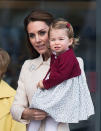 <p>Princess Charlotte said goodbye to Canada on October 1, 2016. The toddler color coordinated with brother George who wore burdungy shorts for the momentous occasion. (Photo: Getty Images) </p>
