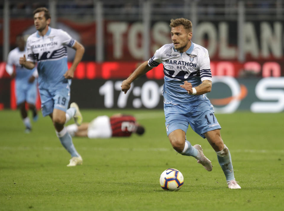 Lazio's Ciro Immobile controls the ball during the Serie A soccer match between AC Milan and Lazio, at the San Siro stadium in Milan, Italy, Saturday, April 13, 2019. (AP Photo/Luca Bruno)