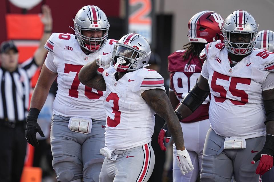 Ohio State running back Miyan Williams (3) reacts after rushing for a touchdown during the second half of an NCAA college football game against Indiana, Saturday, Sept. 2, 2023, in Bloomington, Ind. (AP Photo/Darron Cummings)