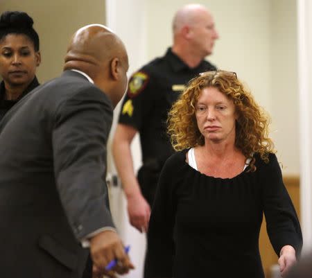 Tonya Couch (R) is escorted to her defense team in Criminal District Court in Fort Worth, Texas, January 11, 2016. REUTERS/David Kent/Ft. Worth Star-Telegram/Pool