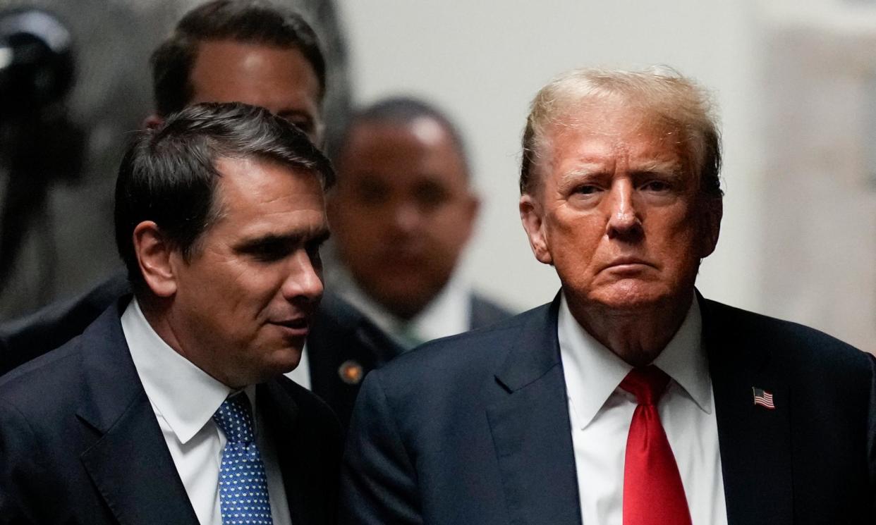 <span>Donald Trump leaves court on Tuesday.</span><span>Photograph: Julia Nikhinson/EPA</span>