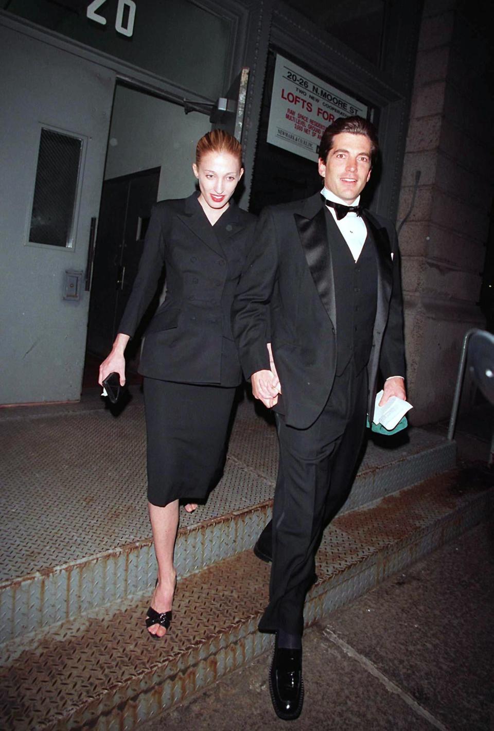 Carolyn Bessette-Kennedy, wearing a Yohji Yamamoto jacket, and John F. Kennedy Jr. ahead of a Municipal Arts Society gala in 1997, quiet luxury, minimalism