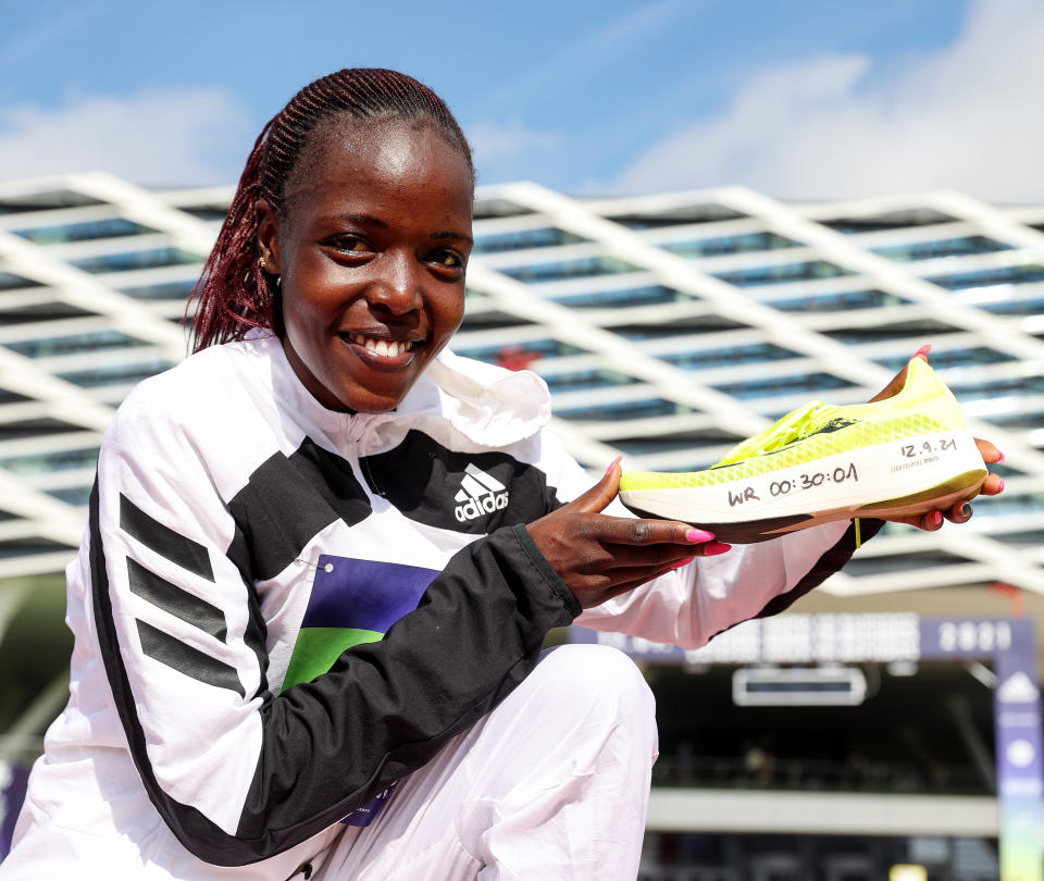 Seen here, Kenya's Agnes Tirop posing for a photo after her 10km world record.