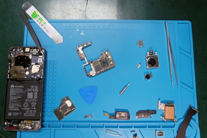 Huawei Pura 70 smartphone during a teardown, in Shenzhen
