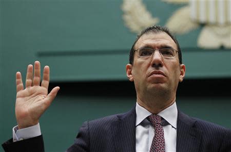 Andrew Slavitt, Executive Vice President for Optum/QSSI is sworn-in to testify at a House Energy and Commerce Committee hearing on the Patient Protection and Affordable Care Act on Capitol Hill in Washington, October 24, 2013. REUTERS/Jason Reed