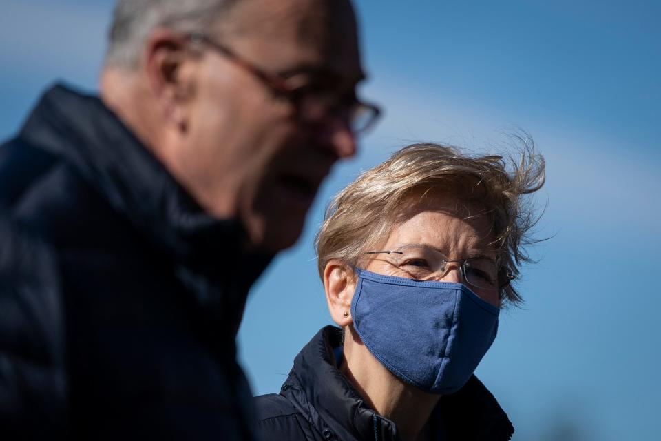 Senate Majority Leader Chuck Schumer and Sen. Elizabeth Warren, D-Mass., at a news conference about student debt on Feb. 4, 2021, in Washington, D.C.