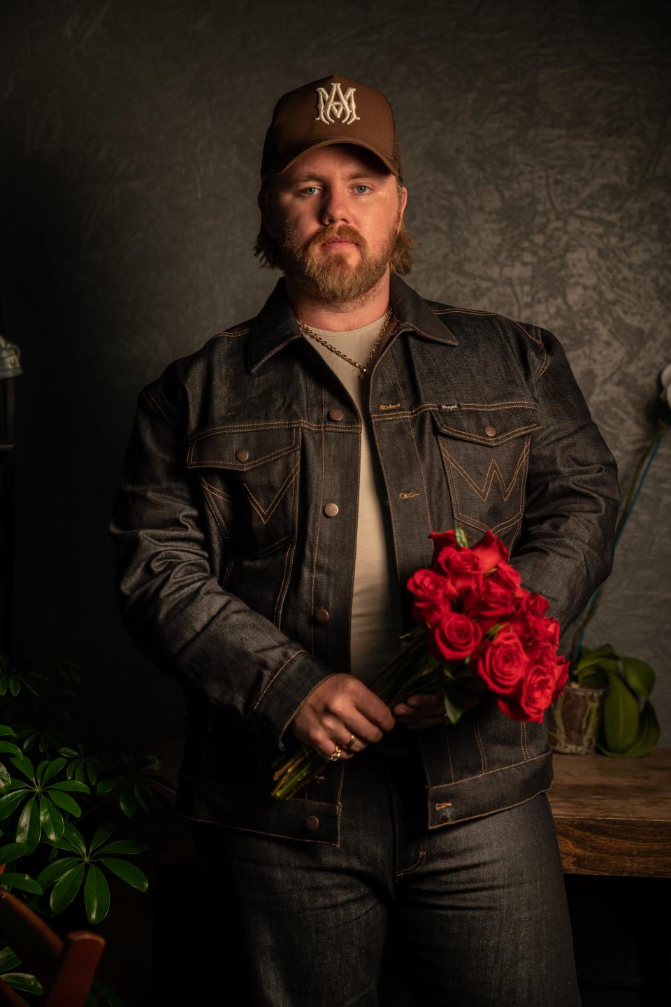 Country music artist Ernest Keith Smith, known as Ernest, poses at Flower Express in Nashville, Tenn., Monday, Jan. 23, 2023. Ernest has an upcoming deluxe album titled “Two Dozen Roses.”