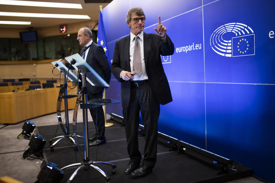 European Parliament President David Sassoli talks to a member of his team during a news conference at the European Parliament in Brussels, Thursday, Sept. 12, 2019. Sassoli says Prime Minister Boris Johnson's government has made no new proposals that would unblock Brexit talks and that talking about removing the so-called backstop from the divorce agreement is a waste of time. (AP Photo/Francisco Seco)
