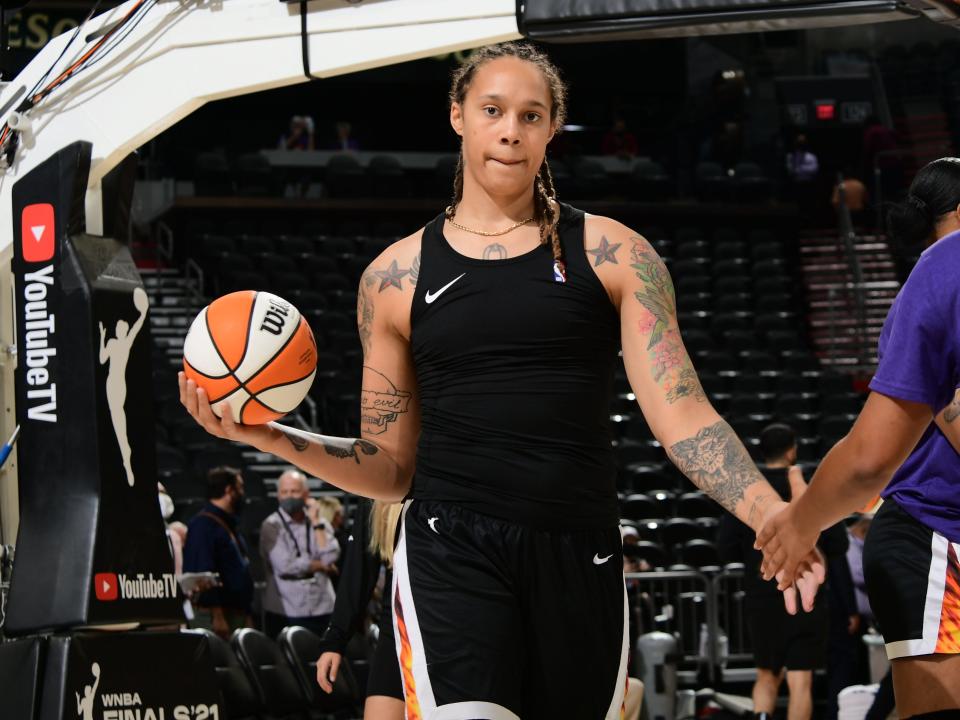 Brittney Griner #42 of the Phoenix Mercury high fives her teammate before Game Two of the 2021 WNBA Finals against the Chicago Sky on October 13, 2021 at Footprint Center in Phoenix, Arizona.