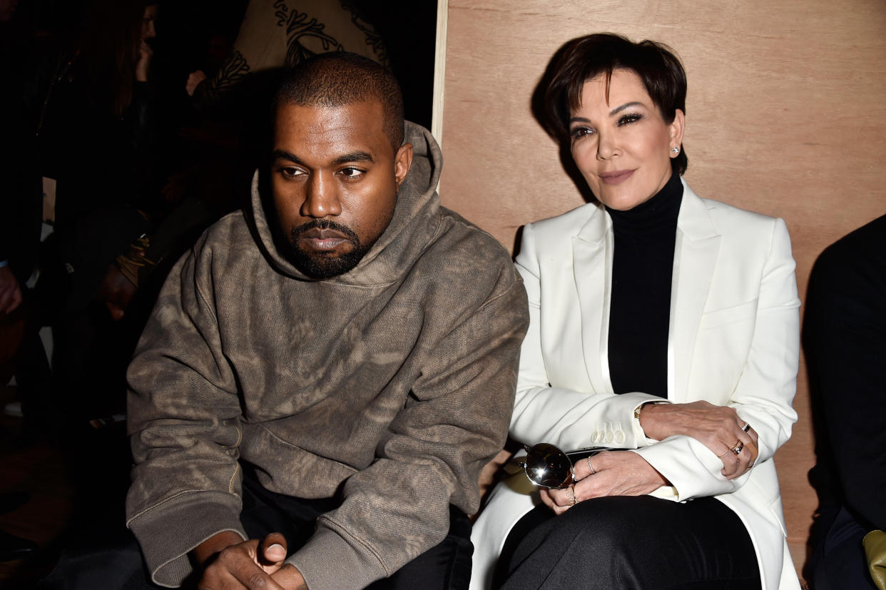 Kanye West and Kris Jenner attend the Givenchy show&nbsp;at Paris Fashion Week in 2016. (Photo: Pascal Le Segretain via Getty Images)