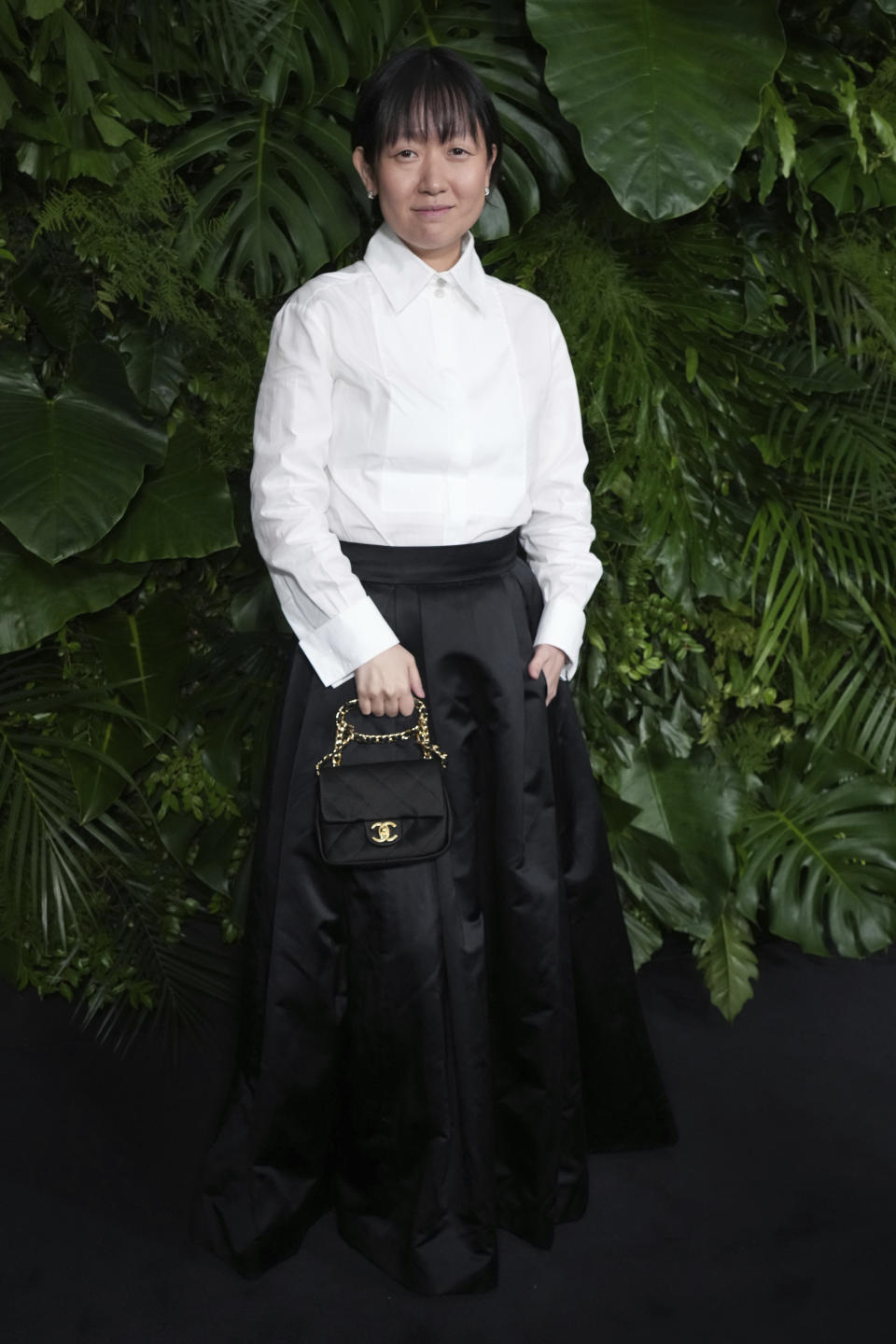 Celine Song arrives at Chanel's 15th Annual Pre-Oscar Awards Dinner on Saturday, March 9, 2024, at the Beverly Hills Hotel in Los Angeles. (Photo by Jordan Strauss/Invision/AP)