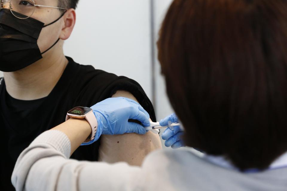 Japanese man receives moderna vaccine