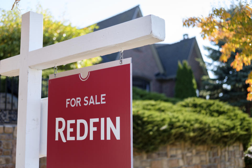 SEATTLE, WA - OCTOBER 31: A Redfin real estate yard sign is pictured in front of a house on October 31, 2017 in Seattle, Washington. Seattle has been one of the fastest and most competitive housing markets in the United States throughout 2017. (Photo by Stephen Brashear/Getty Images for Redfin)