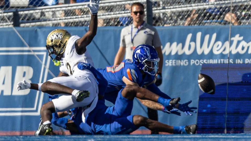 Boise State safety Alexander Teubner intercepts a deflected pass intended for UCF wide receiver Kobe Hudson in the 1st quarter, Saturday, Sept. 9, 2023.