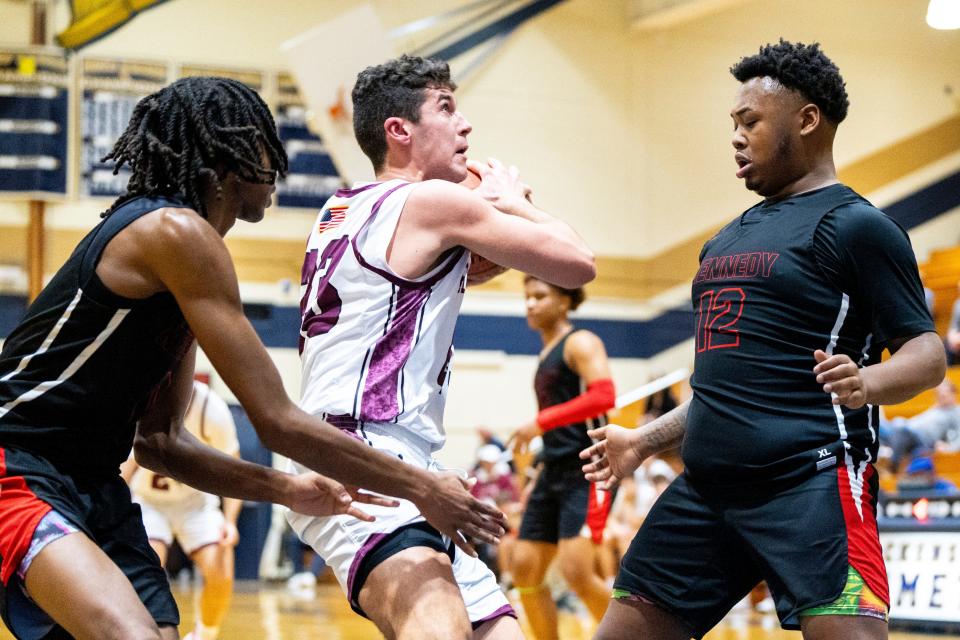 Jan 6, 2024; Hackensack, New Jersey, US; Kennedy plays Ridgewood in the Mel Henderson basketball showcase at Hackensack High. From left, K #0 Micah Pierce, R #23 Tyler Nesland and K #12 Lamar McQueen.