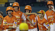 River Ridge, La;'s Reece Roussel (22) heads back to the dugout after his grand slam off South Riding, Va.' Justin Lee during the fourth inning of a baseball game at the Little League World Series in South Williamsport, Pa., Thursday, Aug. 22, 2019. Louisiana won 10-0. (AP Photo/Tom E. Puskar)