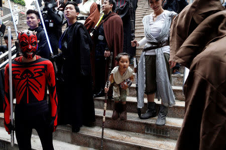 Fans dressed as the characters from "Star Wars" react during Star Wars Day in Taipei, Taiwan May 4, 2017. REUTERS/Tyrone Siu