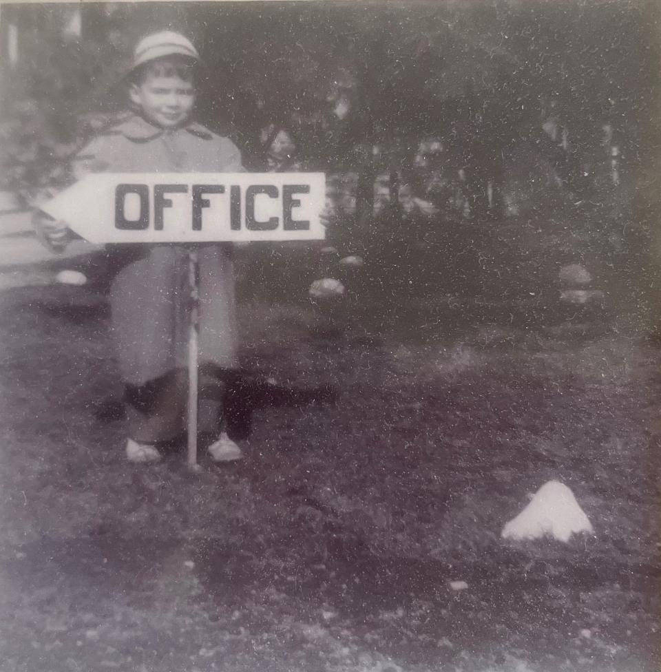 Maurice's Campground owner John Gauthier, at age 5, holds a sign at the South Wellfleet business, which his parents began in 1949.