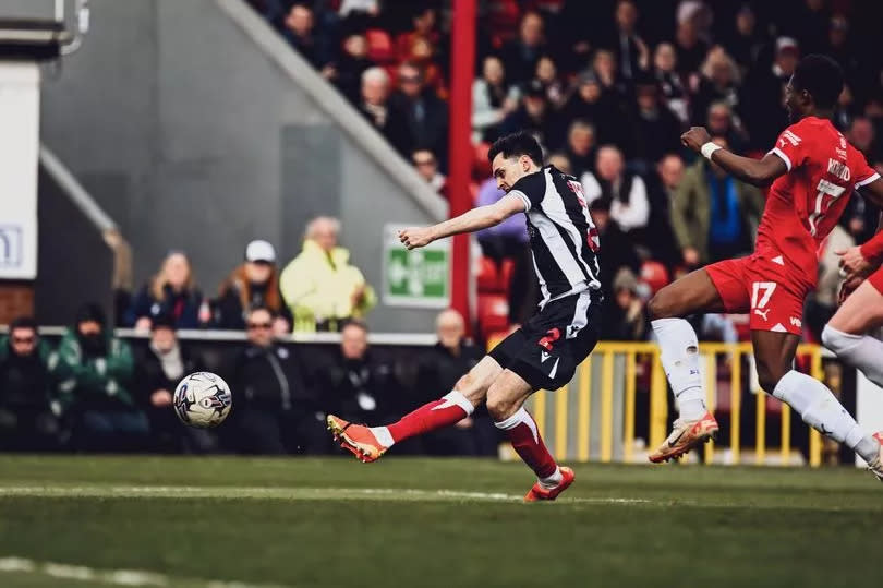 Liam Smith scores during the Sky Bet League Two match between Grimsby Town FC and Swindon Town FC at Blundell Park -Credit:Jon Corken