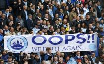 Manchester City fans hold a banner as their team take on West Ham United during their English Premier League soccer match at the Etihad Stadium in Manchester, northern England May 11, 2014. REUTERS/Darren Staples (BRITAIN - Tags: SPORT SOCCER) FOR EDITORIAL USE ONLY. NOT FOR SALE FOR MARKETING OR ADVERTISING CAMPAIGNS. NO USE WITH UNAUTHORIZED AUDIO, VIDEO, DATA, FIXTURE LISTS, CLUB/LEAGUE LOGOS OR "LIVE" SERVICES. ONLINE IN-MATCH USE LIMITED TO 45 IMAGES, NO VIDEO EMULATION. NO USE IN BETTING, GAMES OR SINGLE CLUB/LEAGUE/PLAYER PUBLICATIONS