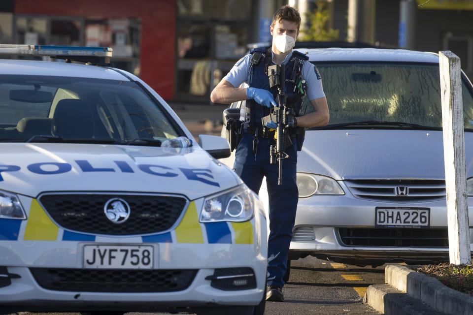 Armed police stand outside a supermarket in Auckland, New Zealand, Saturday, Sept. 4, 2021. New Zealand authorities say they shot and killed a violent extremist, Friday Sept. 3, after he entered a supermarket and stabbed and injured six shoppers. Prime Minister Jacinda Ardern described Friday's incident as a terror attack. (AP Photo/Brett Phibbs)